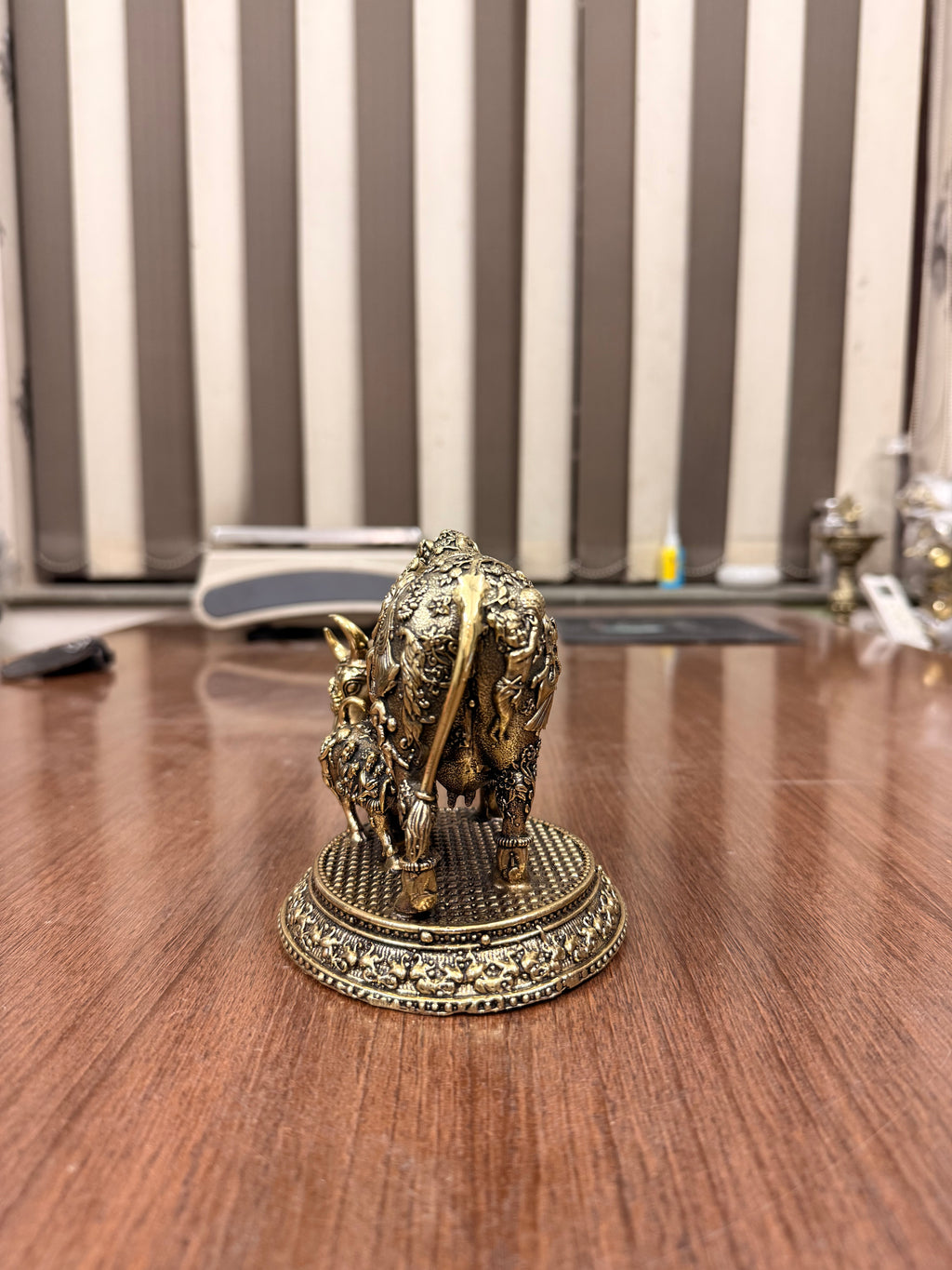 Handcrafted Brass Kamdhenu Cow with highly detailed work and figuring on body with Raslila radha krishna by silverartisians