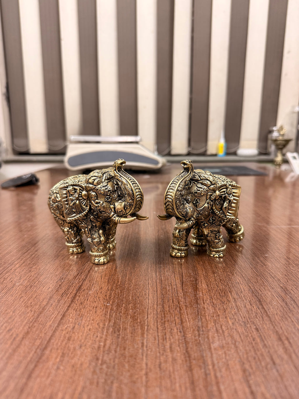 Handcrafted Brass Elephant Pair with Intricate Radha Krishna Raslila Engravings