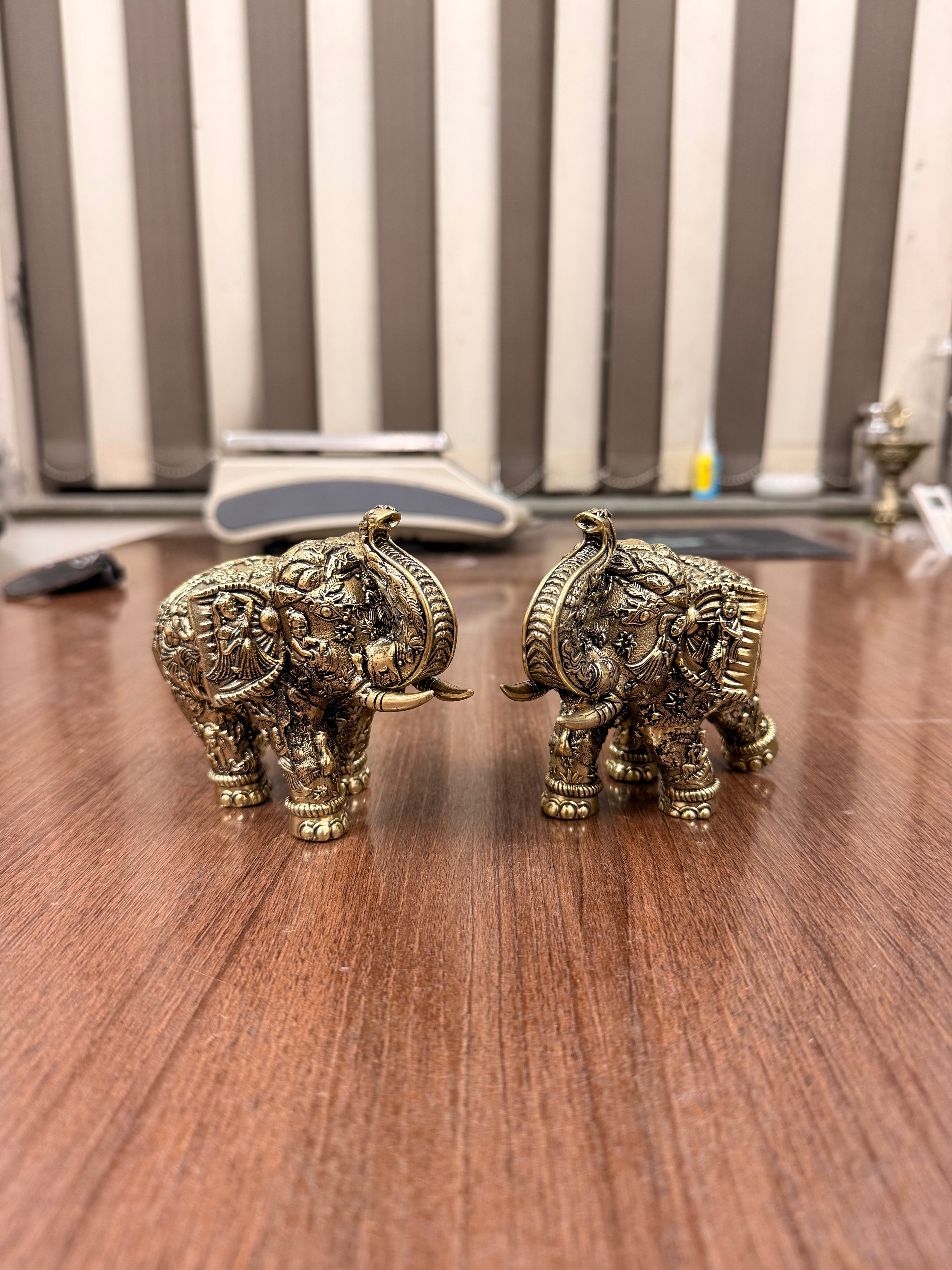 Handcrafted Brass Elephant Pair with Intricate Radha Krishna Raslila Engravings